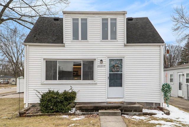 view of front of house with roof with shingles