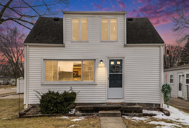 view of front of property with a shingled roof