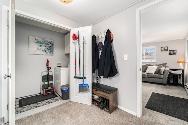 interior space featuring carpet floors, washer / clothes dryer, and ornamental molding