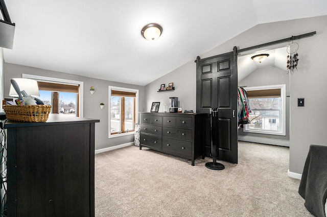 carpeted bedroom with a barn door, baseboard heating, vaulted ceiling, and multiple windows