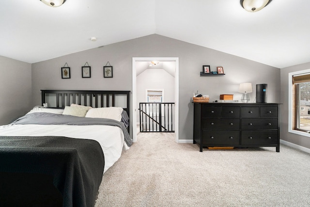 bedroom with baseboards, vaulted ceiling, and carpet flooring