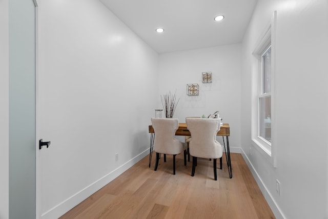 dining space with baseboards, recessed lighting, and light wood-style floors