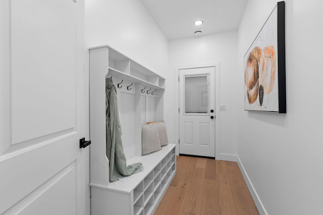 mudroom featuring light wood-type flooring and baseboards