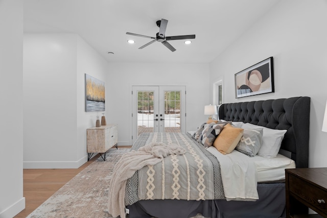 bedroom featuring access to exterior, french doors, recessed lighting, wood finished floors, and baseboards