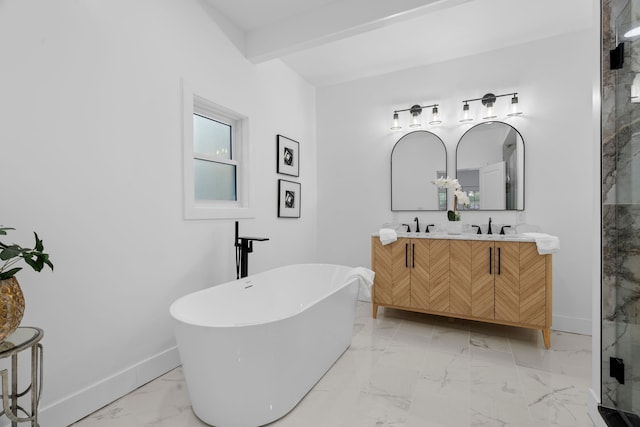 bathroom featuring double vanity, baseboards, marble finish floor, a freestanding bath, and beam ceiling