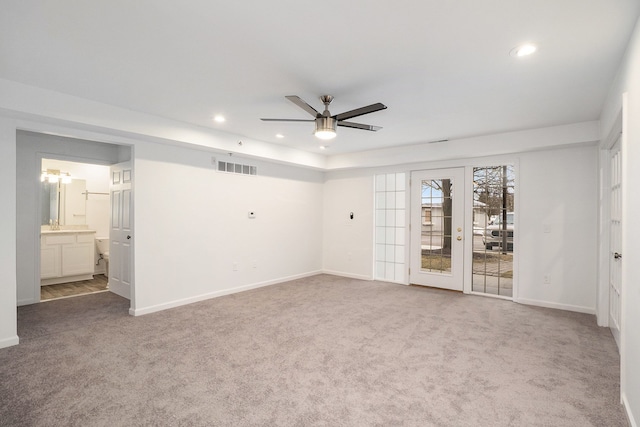 unfurnished room with carpet flooring, recessed lighting, and visible vents