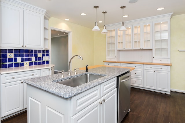 kitchen with a kitchen island with sink, a sink, white cabinetry, stainless steel dishwasher, and dark wood-style floors