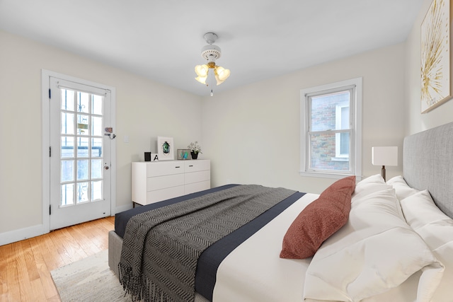 bedroom featuring baseboards and hardwood / wood-style floors