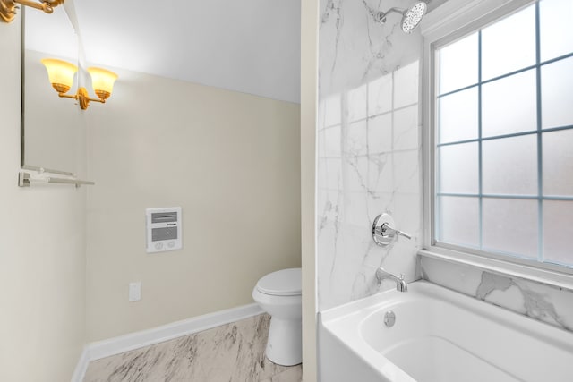 full bath featuring toilet, marble finish floor, baseboards, and a wealth of natural light