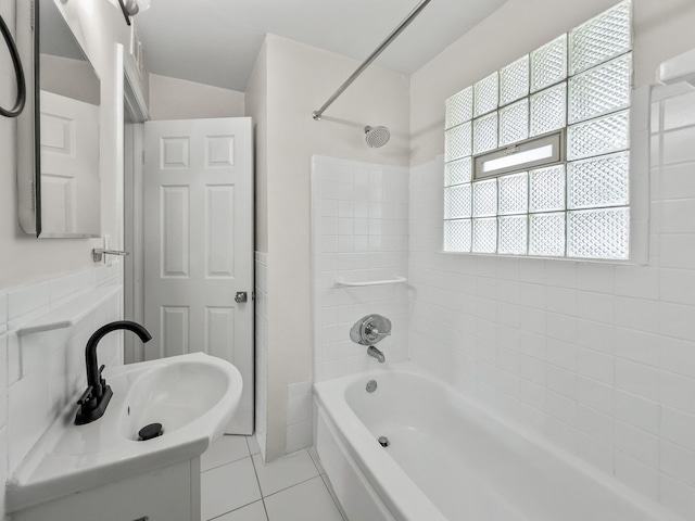 full bathroom with a sink, shower / bath combination, and tile patterned flooring