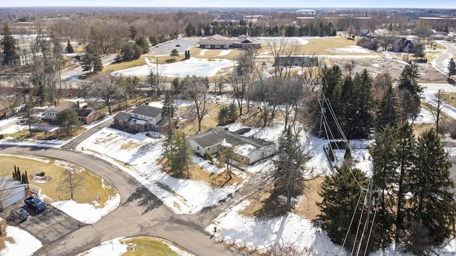 snowy aerial view featuring a residential view