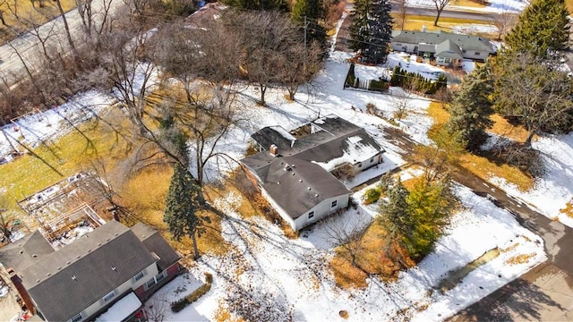 snowy aerial view with a residential view