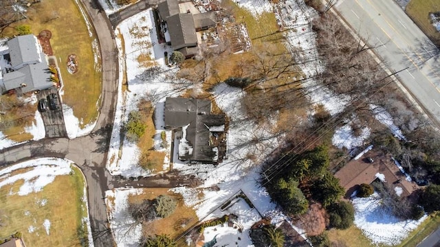 snowy aerial view featuring a residential view