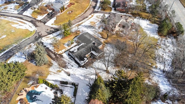 snowy aerial view with a residential view