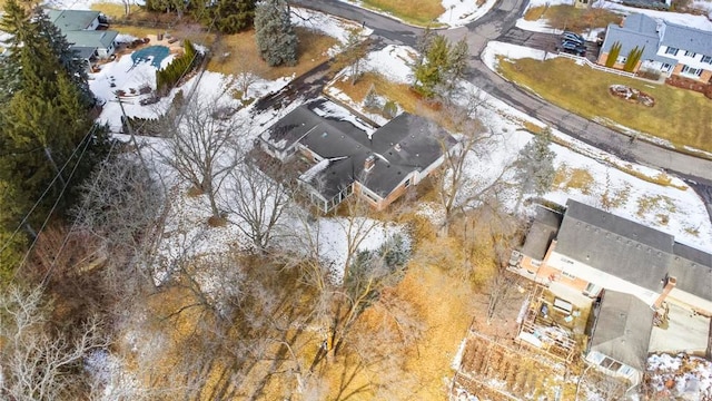 snowy aerial view featuring a residential view