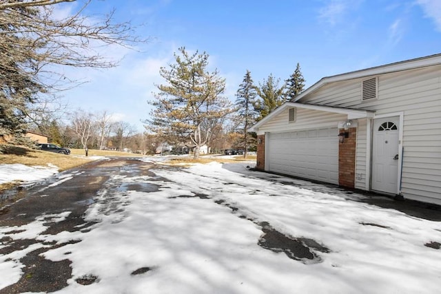 exterior space with a garage