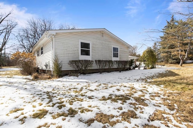 view of snow covered property