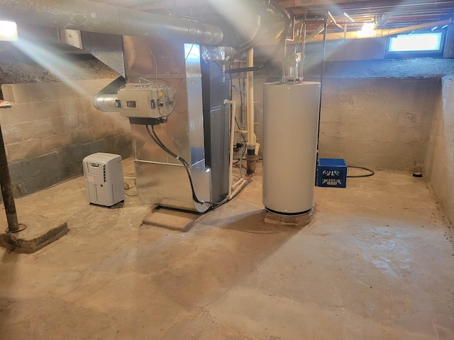 basement featuring gas water heater and heating unit