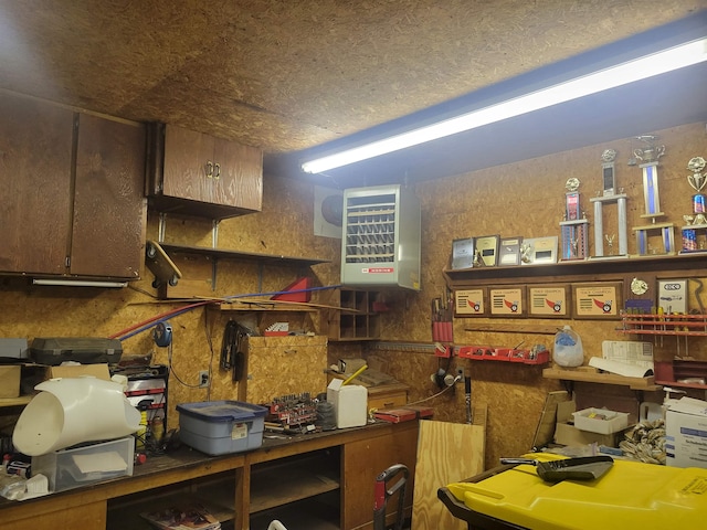 interior space featuring a textured ceiling and a heating unit