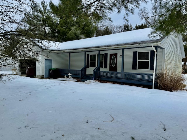 view of front of house featuring a garage and a porch