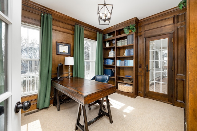 office area featuring a chandelier, visible vents, and light colored carpet