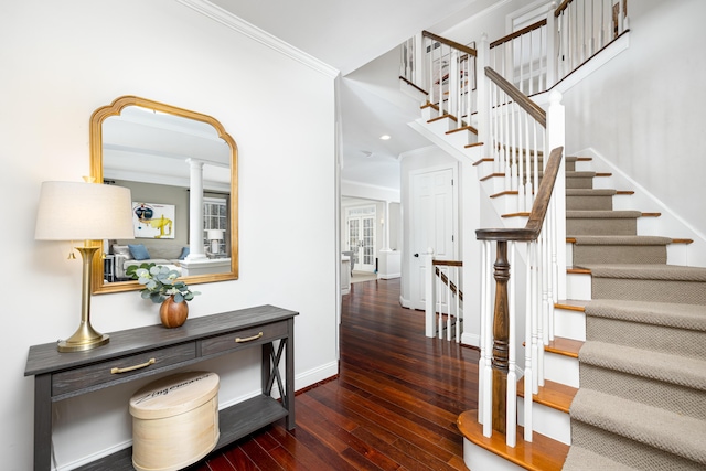 entryway with baseboards, dark wood finished floors, and crown molding