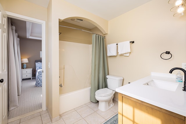 bathroom with ensuite bathroom, tile patterned flooring, toilet, vanity, and shower / bathtub combination with curtain