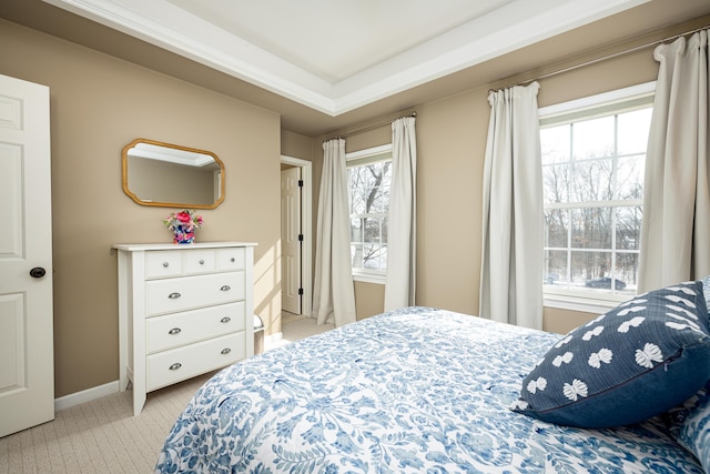 bedroom featuring baseboards and light colored carpet