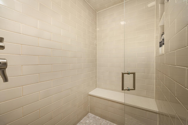 bathroom with a shower stall