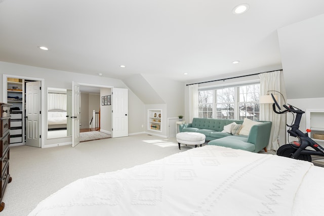 bedroom with lofted ceiling, recessed lighting, baseboards, and light colored carpet