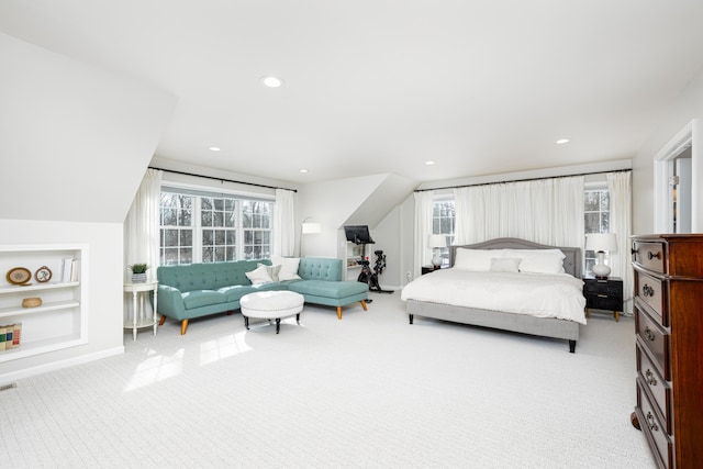 bedroom featuring vaulted ceiling, recessed lighting, visible vents, and light colored carpet