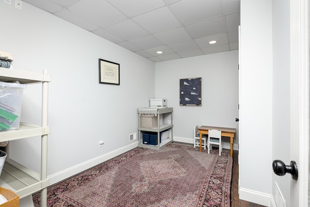 interior space with a paneled ceiling, visible vents, baseboards, and recessed lighting