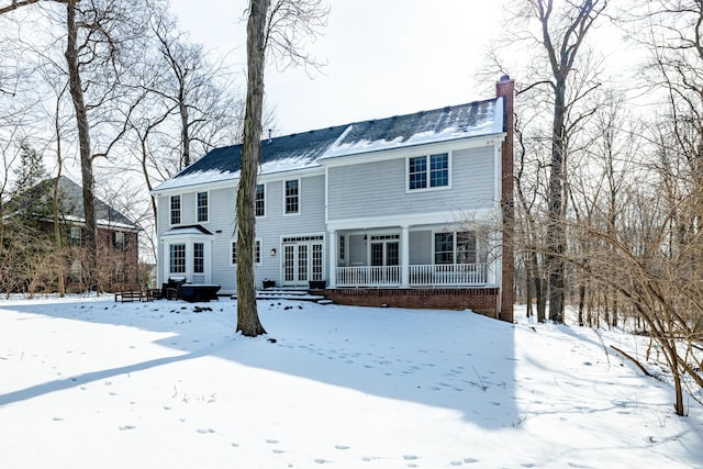 colonial-style house with a chimney