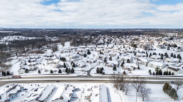 snowy aerial view featuring a residential view