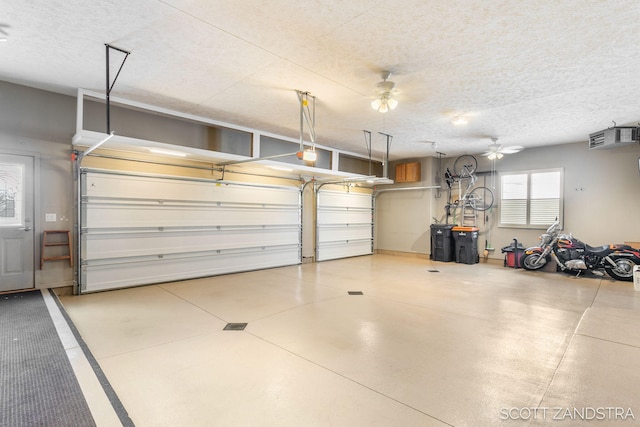 garage featuring ceiling fan and a garage door opener