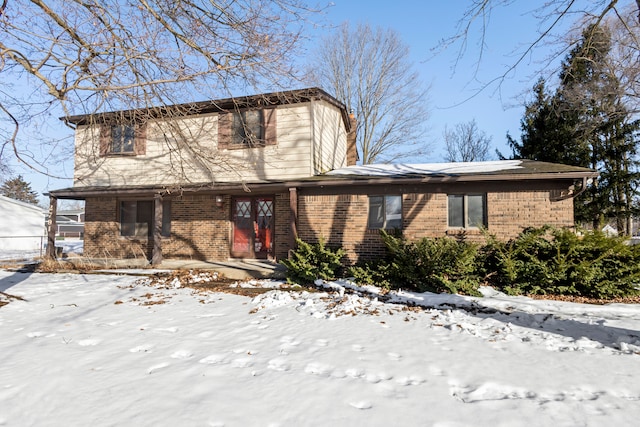 view of front of home with brick siding