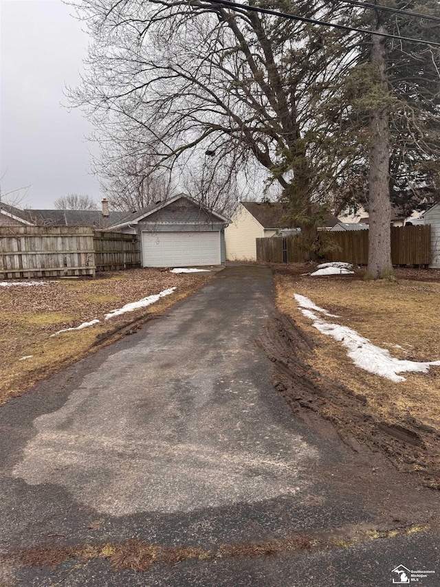 exterior space with a garage and fence