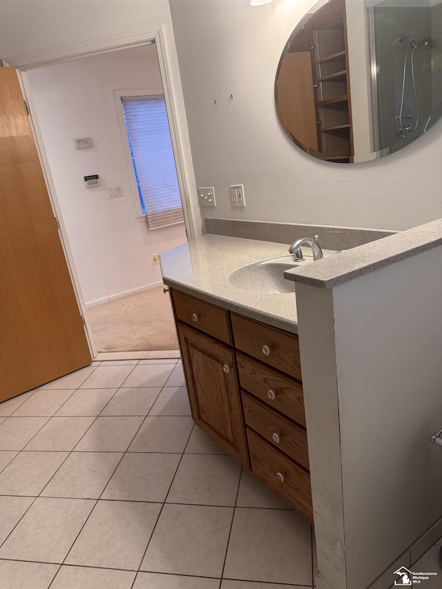 bathroom featuring tile patterned flooring and vanity