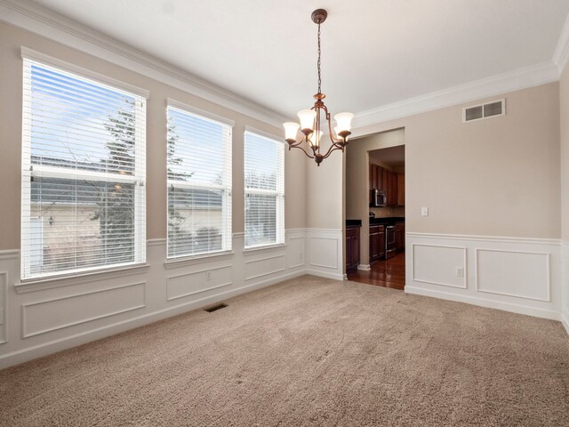 unfurnished dining area with a wealth of natural light, visible vents, and carpet floors