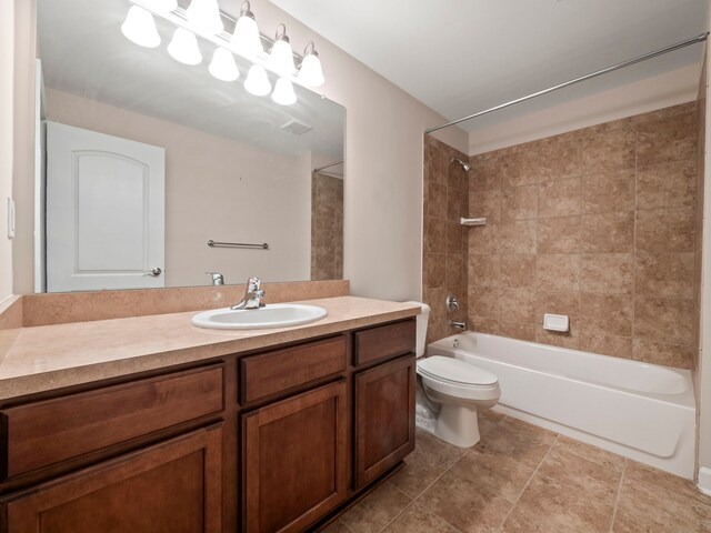 full bathroom featuring tile patterned floors, toilet, vanity, and bathtub / shower combination