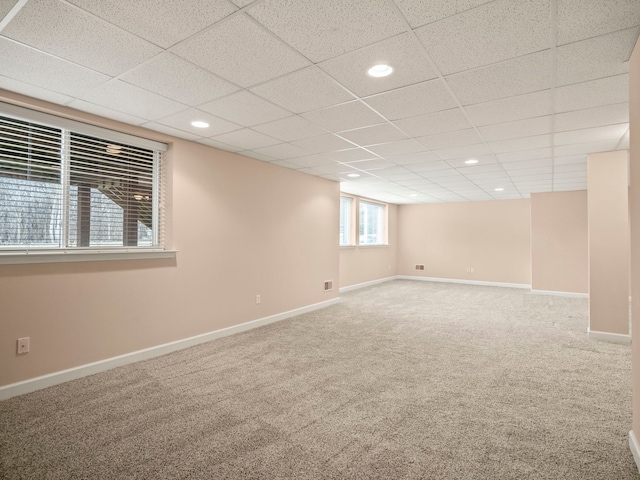 interior space featuring recessed lighting, a paneled ceiling, baseboards, and carpet flooring