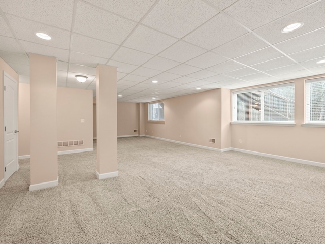 below grade area featuring carpet, recessed lighting, baseboards, and visible vents