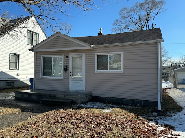 bungalow-style house featuring a shingled roof