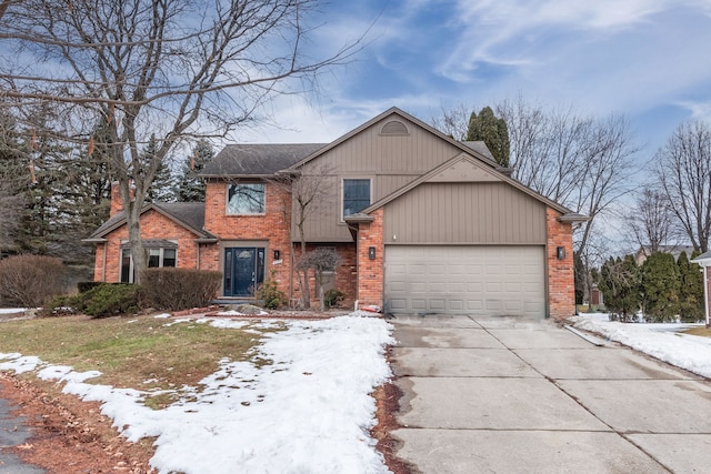 view of front of home featuring a garage, concrete driveway, and brick siding