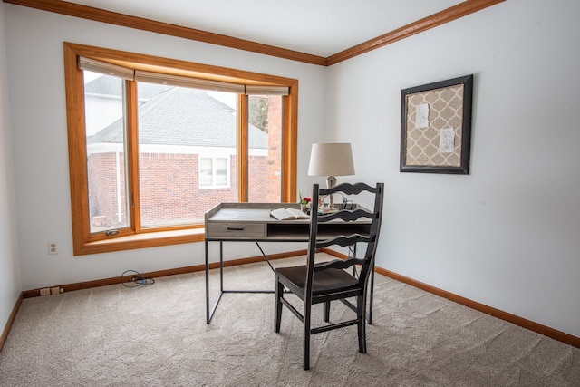 carpeted office space with crown molding and baseboards