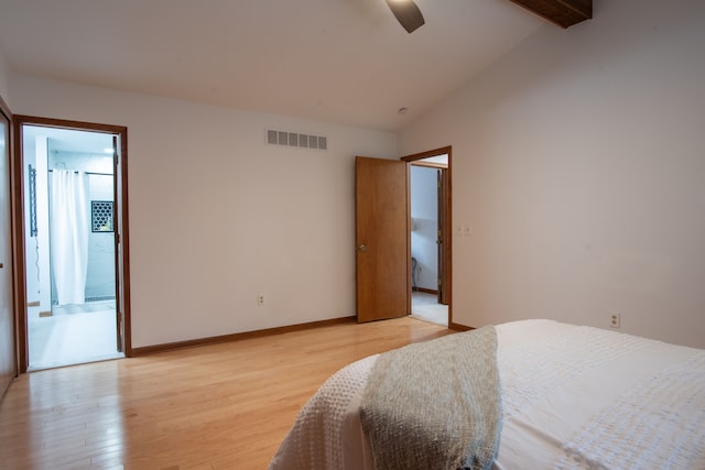 bedroom with lofted ceiling with beams, ceiling fan, visible vents, baseboards, and light wood-style floors