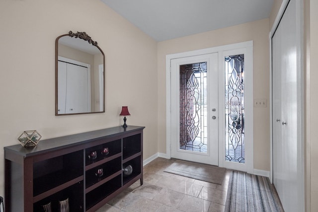 foyer entrance with baseboards