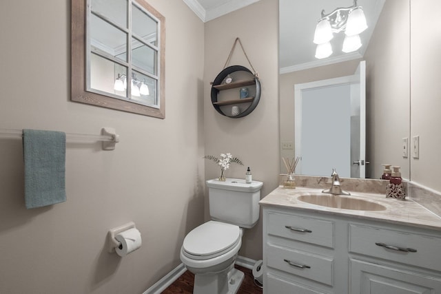 half bathroom featuring baseboards, toilet, ornamental molding, and vanity