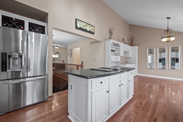 kitchen featuring white cabinets, lofted ceiling, stainless steel refrigerator with ice dispenser, and open shelves