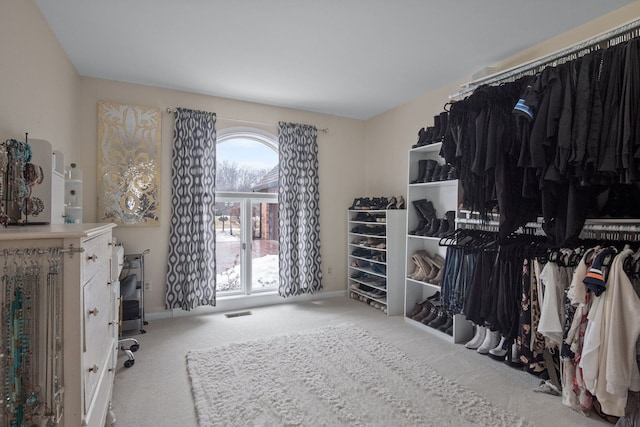 spacious closet featuring carpet flooring and visible vents